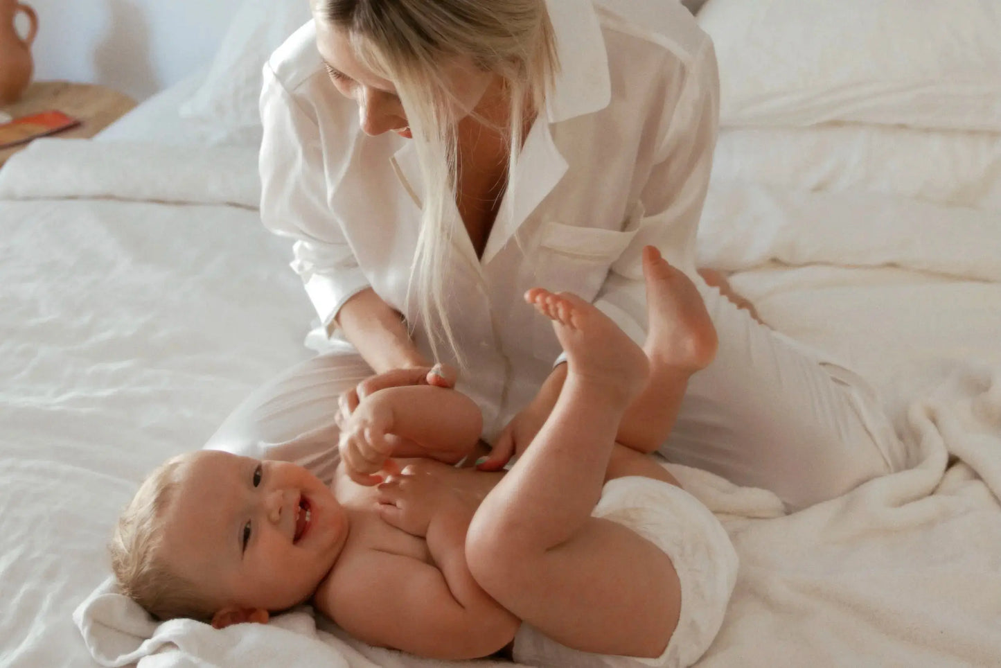Mother changing a baby's nappy